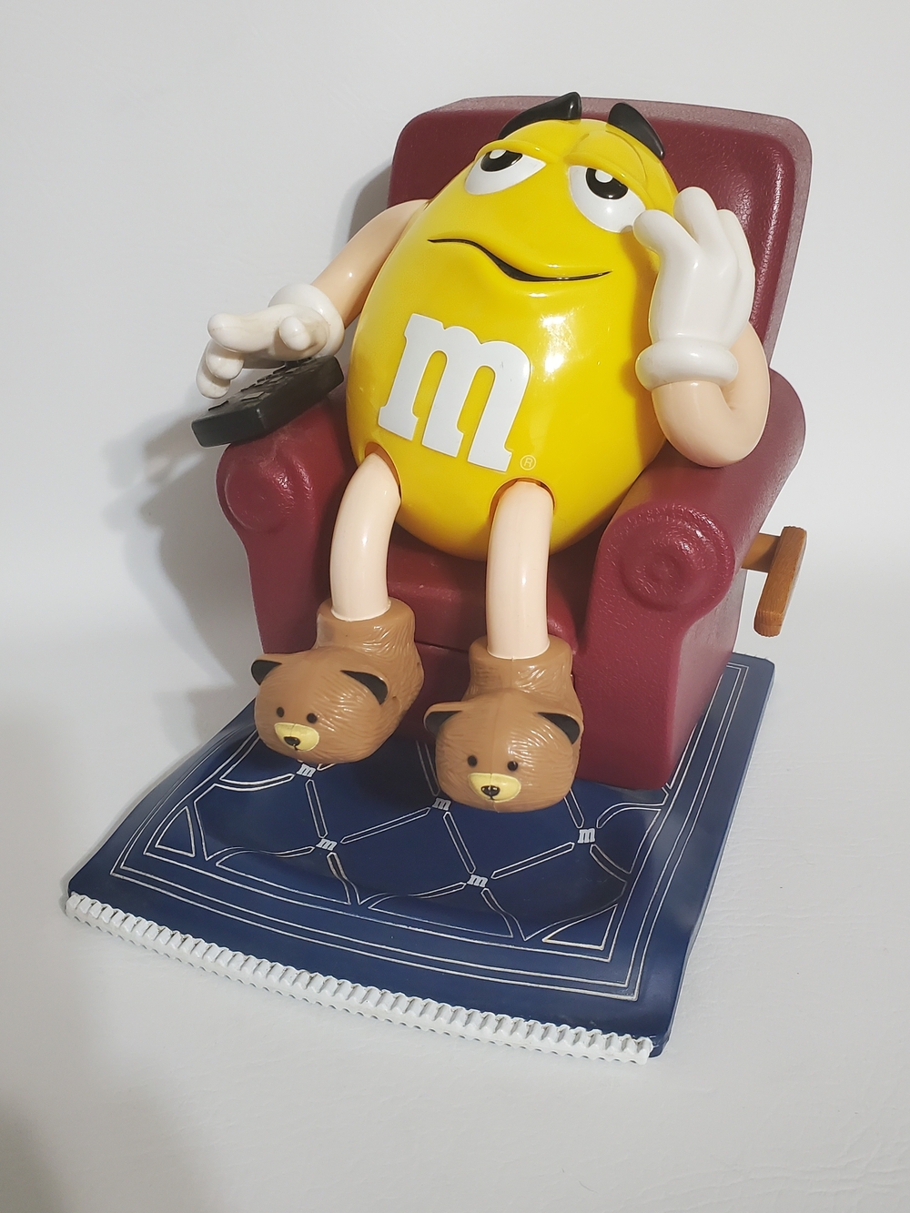 M&M'S Dispenser Yellow Character in Burgundy Recliner with Brown Bear Slippers